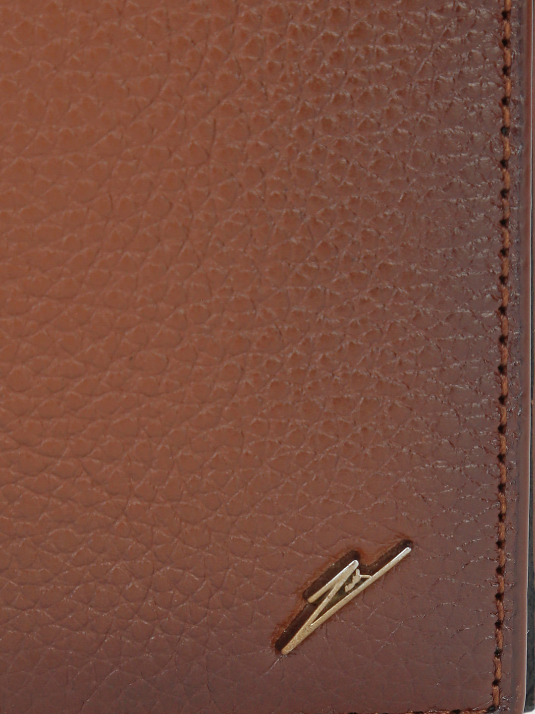 VAULT – Tan